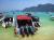 THAILAND, Koh Phi Phi Don - lunch of tourists on the big island of koh phi phi don, this bay is full of tropical and coral fish, forward to a little diving and work up an appetite!.